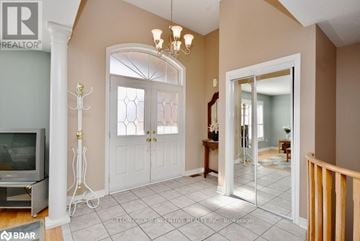 Barrie (Innis-Shore) triplex for rent - A living room with a television and a chandelier.