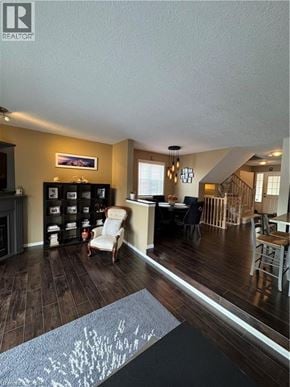 Waterloo townhouse for rent - A living room with a grey rug and a wooden floor.