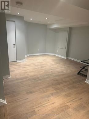Vaughan (Vellore Village) apartment for rent - A room with wooden flooring and a bench in the corner.