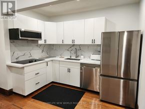 Niagara Falls (Cherrywood) apartment for rent - A modern kitchen with white cabinets and stainless steel appliances.