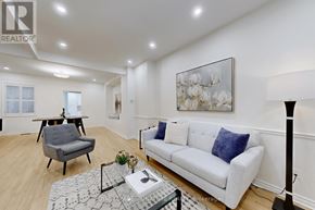 Toronto (Rosedale-Moore Park) apartment for rent - A living room with a grey armchair, a white sofa, and a glass coffee table.