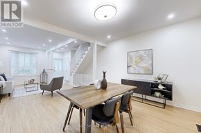 Toronto (Rosedale-Moore Park) apartment for rent - A dining room with a wooden table and chairs.