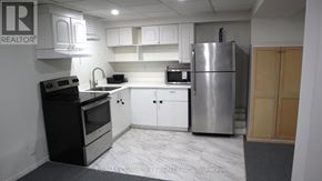 Pickering (Brock Ridge) apartment for rent - A kitchen with a refrigerator, oven, and microwave.