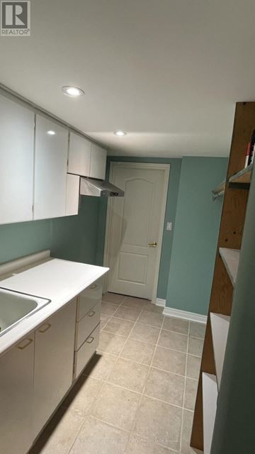 Vaughan (Vellore Village) apartment for rent - A kitchen with white cabinets and a white sink.