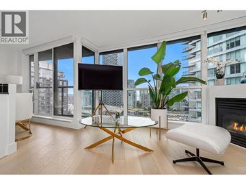 Vancouver apartment for rent - A living room with a glass table and a white sofa.