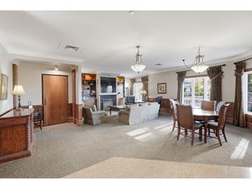 Gatineau (Hull) condo for rent - A spacious living room with a dining table and chairs.