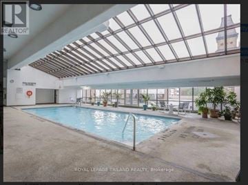 London East (East K) condo for rent - A pool inside a building with a glass ceiling.