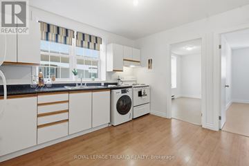 London East (East L) apartment for rent - A white kitchen with a washing machine and a dishwasher.