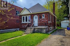 Hamilton apartment for rent - A small red brick house with a white door and a small porch.