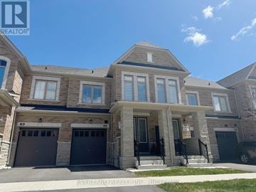 Richmond Hill townhouse for rent - A large, two-story house with a garage is for sale.