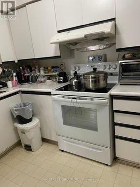 Toronto (O'connor-Parkview) condo for rent - A room with a grey floor and a window with a grey curtain.