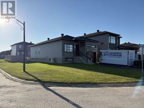 Alfred And Plantagenet apartment for rent - A storage facility is located in front of a row of houses.