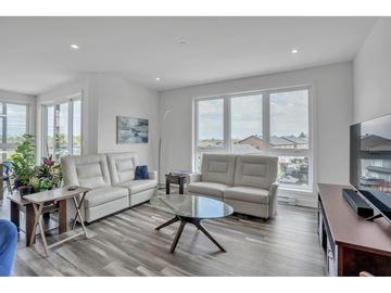 Gatineau (Aylmer) apartment for rent - A living room with a white couch and a glass table.
