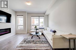 Oshawa (Samac) townhouse for rent - A living room with a white couch and a coffee table.