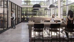 Toronto (Centennial Scarborough) condo for rent - A real estate office with people working and a man walking in.
