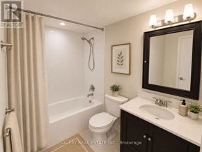 Toronto (Flemingdon Park) condo for rent - A bathroom with a toilet, sink, and shower.