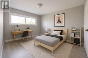 Markham (Royal Orchard) townhouse for rent - A bedroom with a bed, desk, and chair.