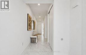Oakville (Go Glenorchy) townhouse for rent - A hallway with a bench and pictures on the wall.