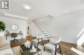 Oakville (Go Glenorchy) townhouse for rent - A living room with a staircase in the background.