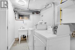 Toronto (South Parkdale) apartment for rent - A white sink and table in a small room.