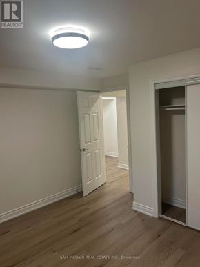 Mississauga (Clarkson) apartment for rent - A room with a white door and a light on the ceiling.