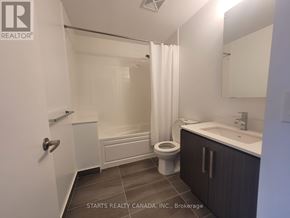 Toronto (Willowdale West) condo for rent - A bathroom with a toilet, sink, and bathtub.