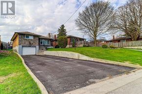 Oshawa (Donevan) apartment for rent - A residential area with a house and a driveway.