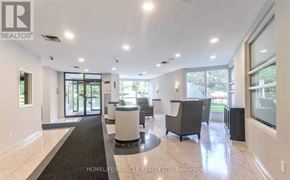 Brampton (Queen Street Corridor) condo for rent - A spacious living room with a black and white color scheme.