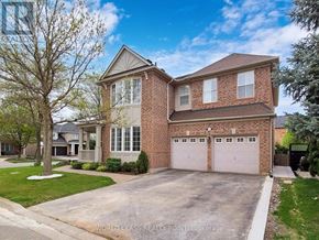 Oakville (Wm Westmount) apartment for rent - A two-story house with a brick facade and a large garage.