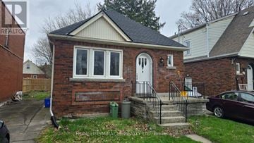 Hamilton (Westdale) apartment for rent - A small brick house with a white door and a window.