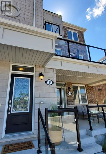 Kitchener townhouse for rent - A house number 124 with a glass railing and a glass door.