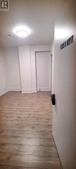 Toronto (Corso Italia-Davenport) apartment for rent - A hallway with a door and a sign that says 1357 AP7.