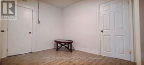 Toronto (Corso Italia-Davenport) apartment for rent - A room with a table and two doors.