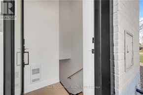 Burlington (Mountainside) apartment for rent - A white door with a black frame is open to a hallway.