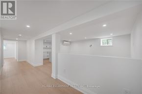 Burlington (Mountainside) apartment for rent - A white interior space with wood flooring and a window.