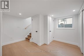 Burlington (Mountainside) apartment for rent - A white room with a staircase and a window.