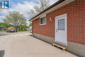 Guelph (Grange Road) apartment for rent - A small house with a white door is shown in the image.