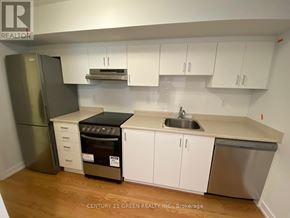 Toronto (Bendale) apartment for rent - A kitchen with white cabinets and a stainless steel dishwasher.