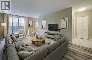 London apartment for rent - A living room with a grey couch and a wooden coffee table.