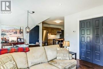 Aurora (Aurora Heights) apartment for rent - A living room with a couch, a lamp, and a painting on the wall.