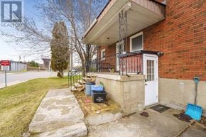 Clarence-Rockland apartment for rent - A red brick house with a white door and a black metal railing.