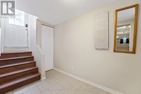 Clarence-Rockland apartment for rent - A hallway with a staircase and a framed quote on the wall.