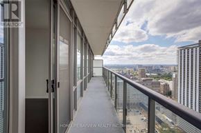 Toronto (Bay Street Corridor) condo for rent - A balcony with a view of the cityscape.
