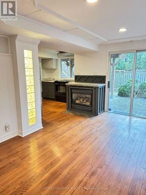 Newmarket (Summerhill Estates) apartment for rent - A modern kitchen with a wood floor and a black stove.