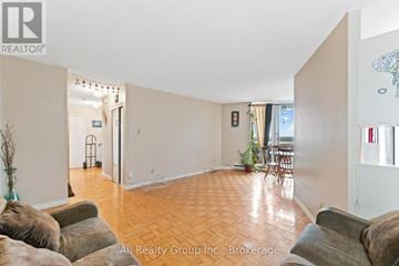 Ottawa condo for rent - A living room with a couch and a chair.