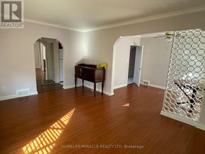 Toronto (Kennedy Park) apartment for rent - A room with a wooden floor and a piano in it.