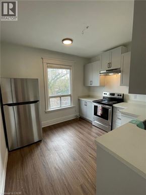Hamilton apartment for rent - A kitchen with a refrigerator, stove, and oven.