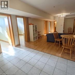 Waterloo condo for rent - A room with a table and chairs in it.