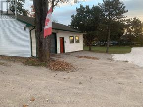Cambridge apartment for rent - A small building with a Canadian flag in front of it.