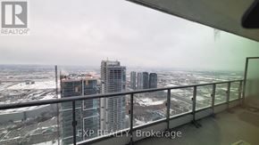Vaughan (Vaughan Corporate Centre) condo for rent - A view from a high-rise building looking out over a cityscape.
